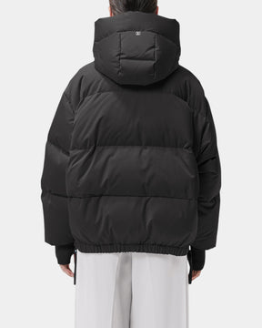 Duno Heka M – Piumino corto oversize in raso tecnico con cappuccio