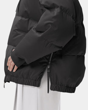 Duno Heka M – Piumino corto oversize in raso tecnico con cappuccio