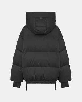 Duno Heka M – Piumino corto oversize in raso tecnico con cappuccio